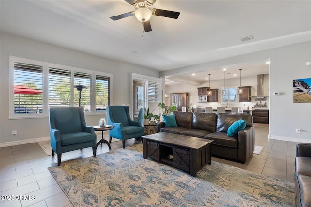 living area featuring visible vents, recessed lighting, tile patterned flooring, baseboards, and ceiling fan