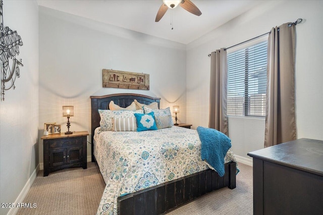 bedroom with a ceiling fan, carpet, and baseboards