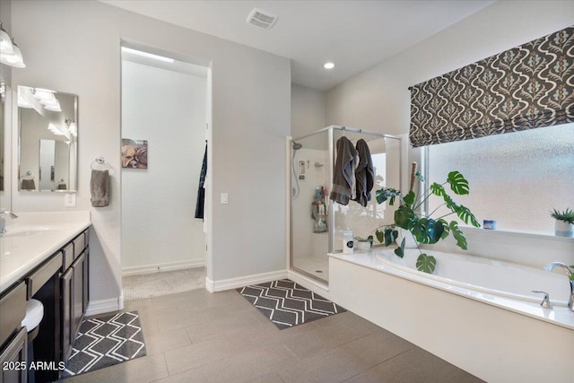 bathroom featuring vanity, visible vents, recessed lighting, a shower stall, and a bath