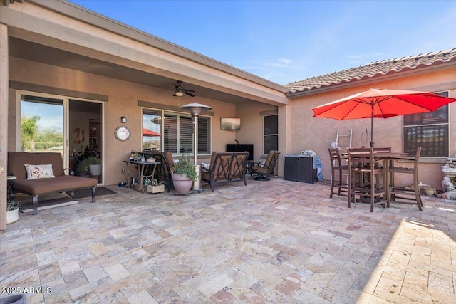 view of patio / terrace featuring outdoor lounge area, outdoor dining area, and ceiling fan