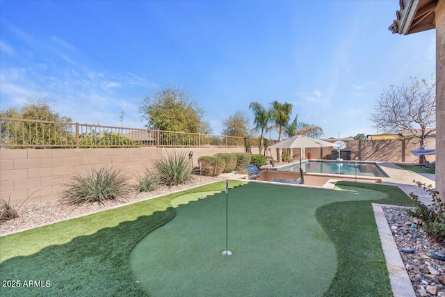 view of yard featuring a patio, a fenced backyard, and a fenced in pool