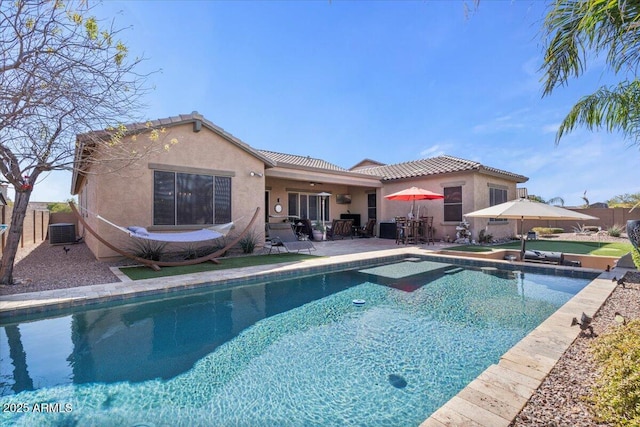 view of swimming pool with a fenced in pool, a patio, central AC, and fence