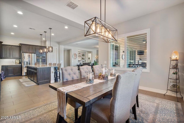 dining space with a chandelier, visible vents, recessed lighting, and baseboards