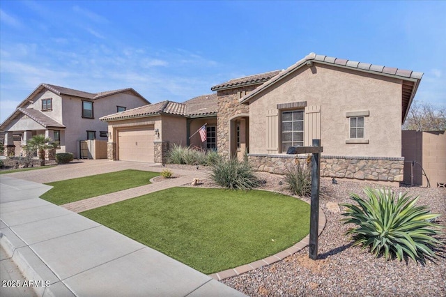 mediterranean / spanish-style home featuring stucco siding, driveway, a tile roof, stone siding, and a garage