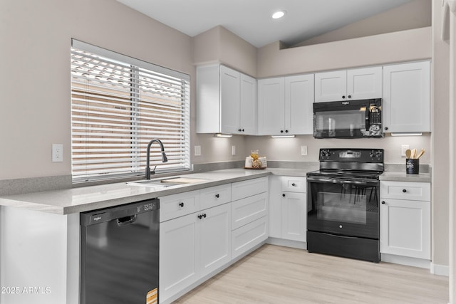 512 W Encinas St, Gilbert, AZ 85233 - kitchen featuring black appliances, a sink, white cabinets, vaulted ceiling, and recessed lighting