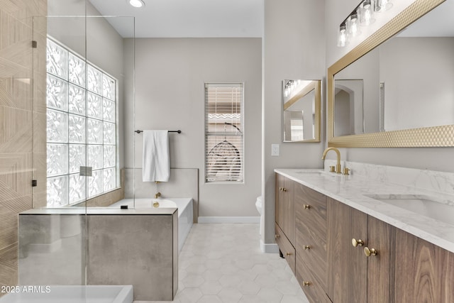 512 W Encinas St, Gilbert, AZ 85233 - full bath featuring double vanity, a garden tub, tile patterned flooring, a walk in shower, and toilet