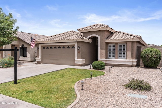512 W Encinas St, Gilbert, AZ 85233 - mediterranean / spanish home featuring a garage, stucco siding, concrete driveway, a tile roof, and a front yard