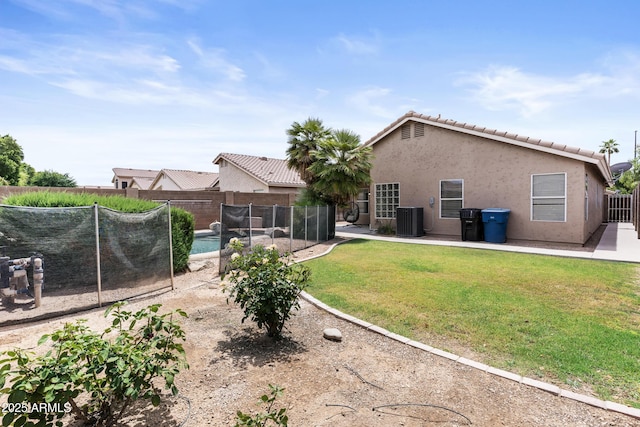 512 W Encinas St, Gilbert, AZ 85233 - back of property featuring central AC unit, stucco siding, a tiled roof, and a patio area