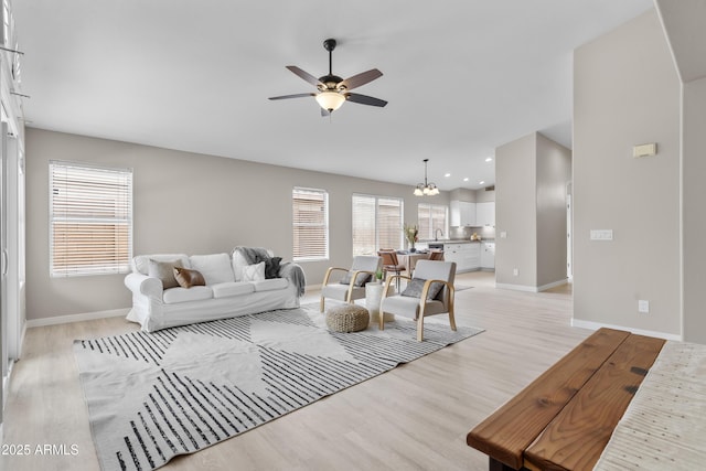 512 W Encinas St, Gilbert, AZ 85233 - living area with light wood-style flooring, ceiling fan, baseboards, a chandelier, and recessed lighting