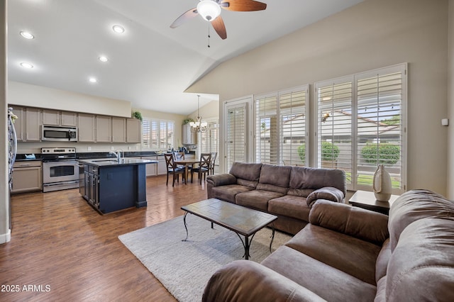 15064 N 54th Way, Scottsdale, AZ 85254 - living room featuring lofted ceiling, a ceiling fan, a chandelier, recessed lighting, and dark wood-style flooring