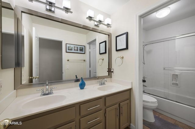 15064 N 54th Way, Scottsdale, AZ 85254 - bathroom with toilet, double vanity, shower / bath combination with glass door, and tile patterned flooring