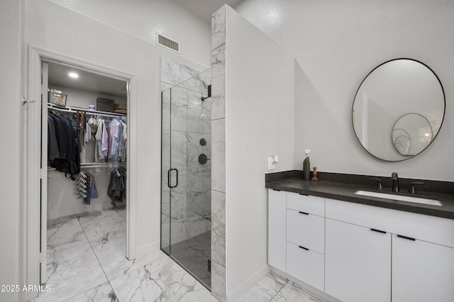 15064 N 54th Way, Scottsdale, AZ 85254 - full bath featuring marble look tile flooring, a marble finish shower, a walk in closet, vanity, and baseboards