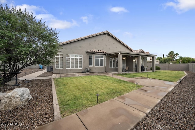 15064 N 54th Way, Scottsdale, AZ 85254 - back of property featuring stucco siding, a patio area, a tiled roof, and central AC unit
