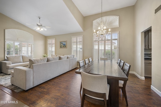 15064 N 54th Way, Scottsdale, AZ 85254 - dining space with a chandelier, high vaulted ceiling, dark wood finished floors, a ceiling fan, and baseboards
