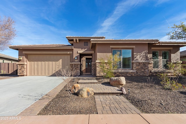 prairie-style home featuring a garage