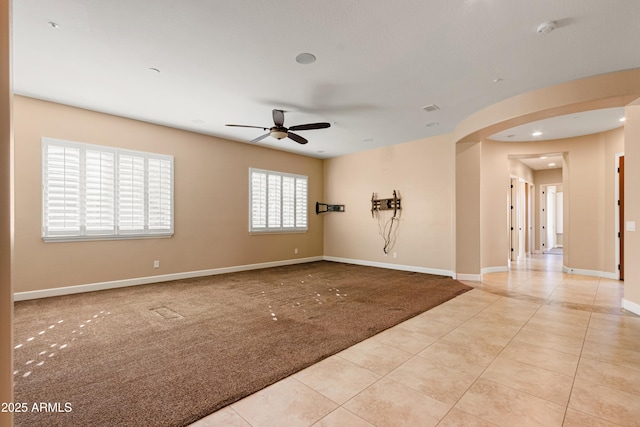 empty room with light carpet and ceiling fan