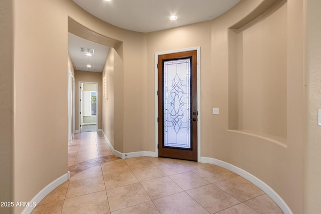 entrance foyer featuring light tile patterned floors