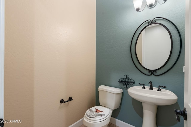 bathroom featuring sink and toilet