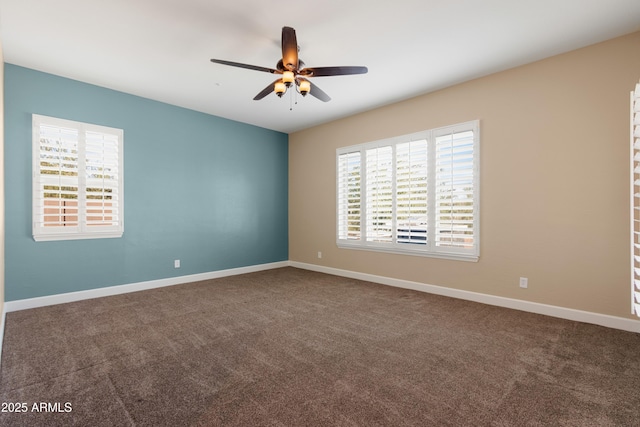 carpeted empty room featuring ceiling fan