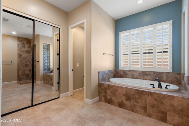 bathroom with tile patterned flooring and plus walk in shower