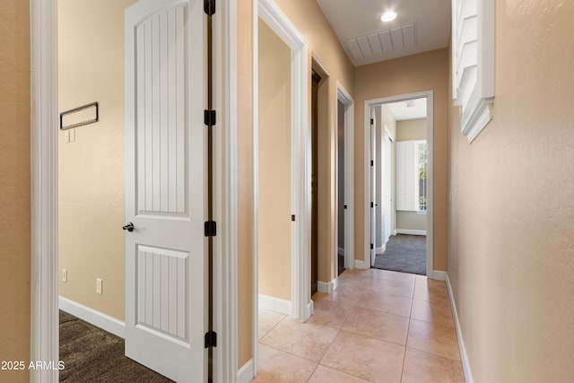 hallway with light tile patterned floors