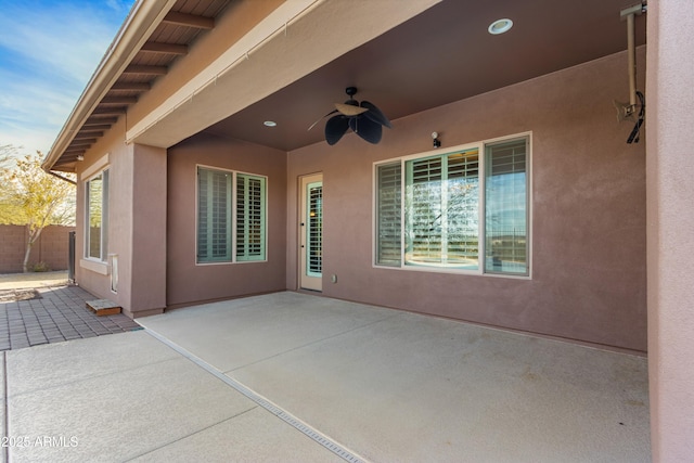 view of patio featuring ceiling fan