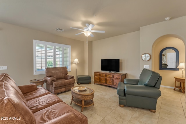 14200 W Village Pkwy Unit 2128, Litchfield Park, AZ 85340 - living room with ceiling fan, light tile patterned flooring, and arched walkways