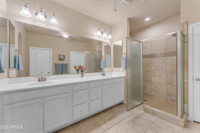 14200 W Village Pkwy Unit 2128, Litchfield Park, AZ 85340 - bathroom with double vanity, a shower stall, ceiling fan, and tile patterned floors