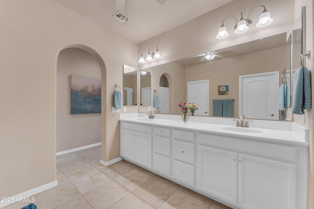 14200 W Village Pkwy Unit 2128, Litchfield Park, AZ 85340 - bathroom featuring ceiling fan, double vanity, and tile patterned flooring