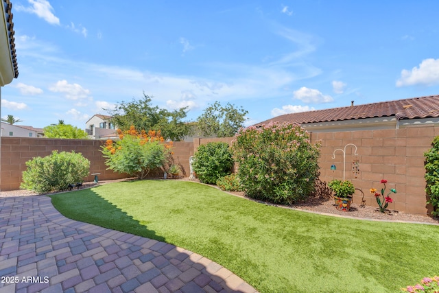 14200 W Village Pkwy Unit 2128, Litchfield Park, AZ 85340 - fenced backyard featuring a patio