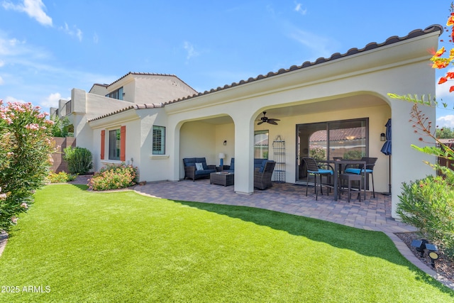 14200 W Village Pkwy Unit 2128, Litchfield Park, AZ 85340 - rear view of house featuring a patio, outdoor lounge area, ceiling fan, stucco siding, and a tile roof