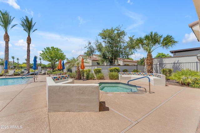 14200 W Village Pkwy Unit 2128, Litchfield Park, AZ 85340 - community pool featuring a patio and a community hot tub