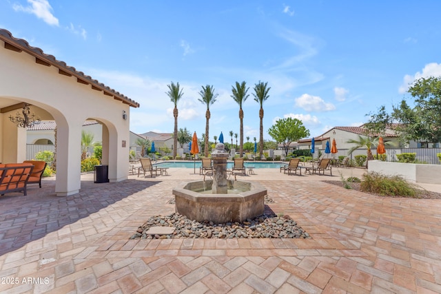 14200 W Village Pkwy Unit 2128, Litchfield Park, AZ 85340 - view of patio with a community pool