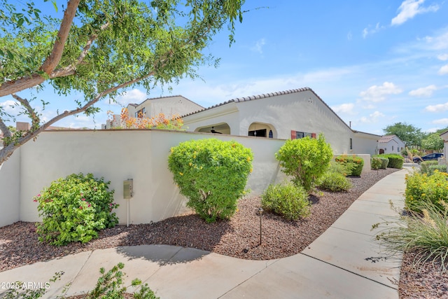 14200 W Village Pkwy Unit 2128, Litchfield Park, AZ 85340 - view of side of home featuring stucco siding