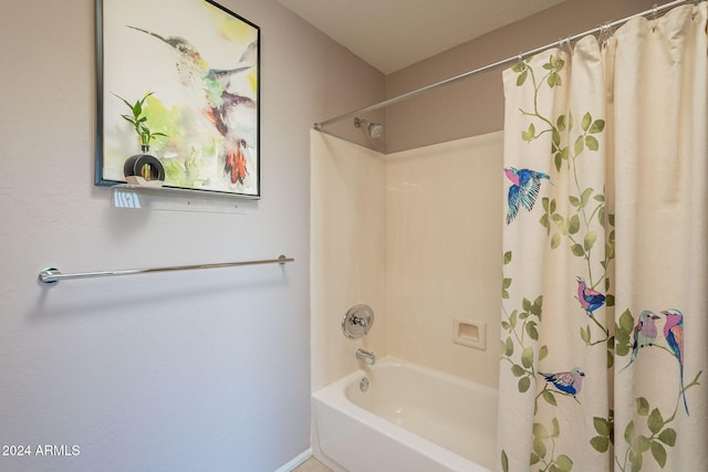 bathroom with shower / tub combo with curtain