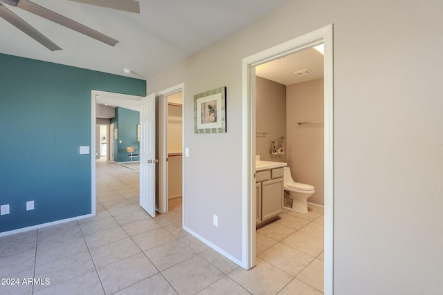 hall with light tile patterned floors