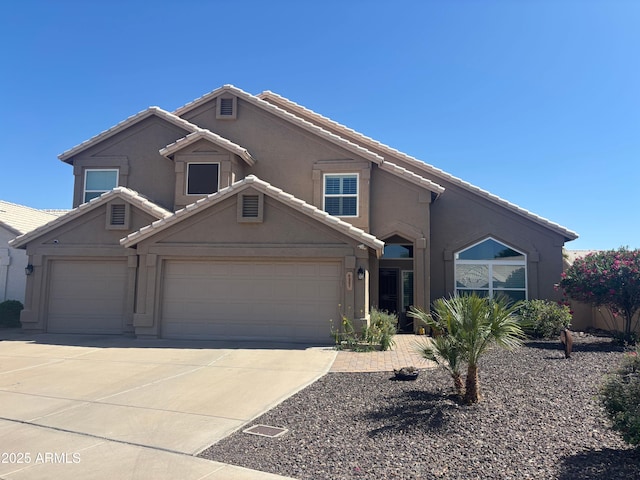 4207 E Rockledge Rd, Phoenix, AZ 85044 - view of front of home with a tile roof, driveway, and stucco siding