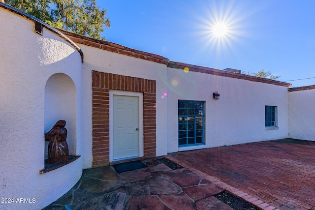 doorway to property featuring a patio