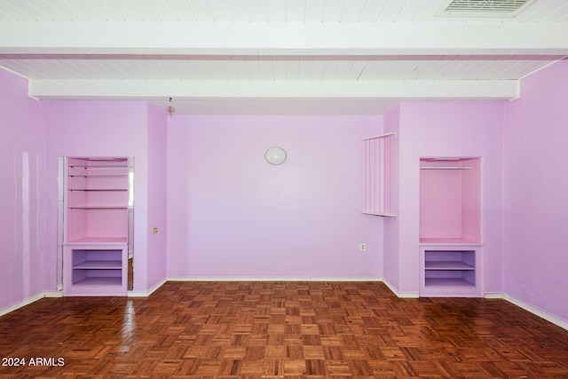 unfurnished room with dark parquet flooring, beam ceiling, and wood ceiling