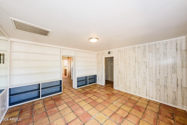 interior space featuring wooden walls