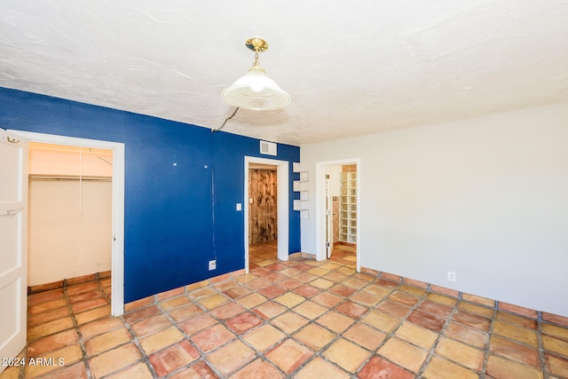 unfurnished bedroom with a closet