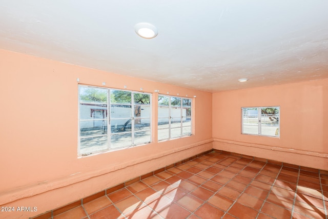 unfurnished room featuring tile patterned flooring