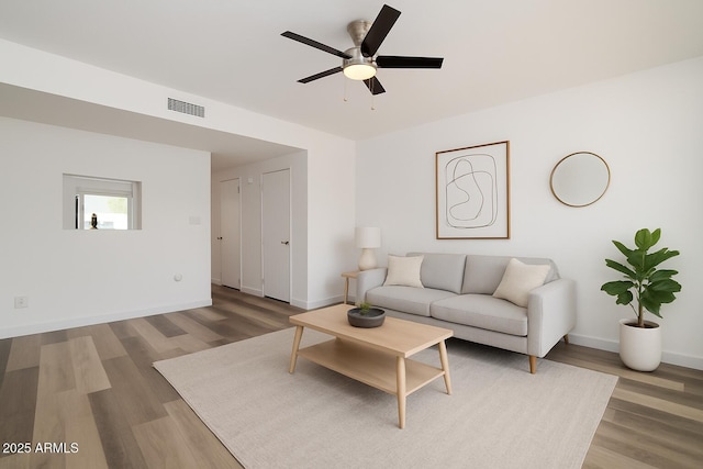 7801 N 44th Dr Unit 1003, Glendale, AZ 85301 - living area with wood finished floors, ceiling fan, and baseboards