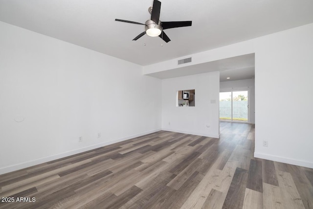7801 N 44th Dr Unit 1003, Glendale, AZ 85301 - empty room with wood finished floors, a ceiling fan, and baseboards