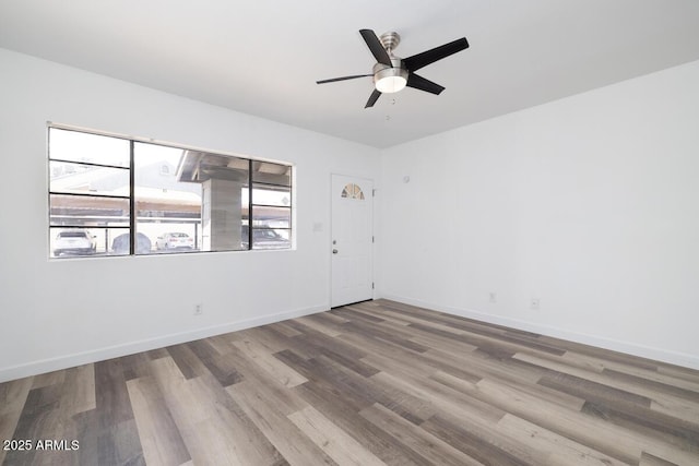 7801 N 44th Dr Unit 1003, Glendale, AZ 85301 - unfurnished room featuring wood finished floors, ceiling fan, and baseboards