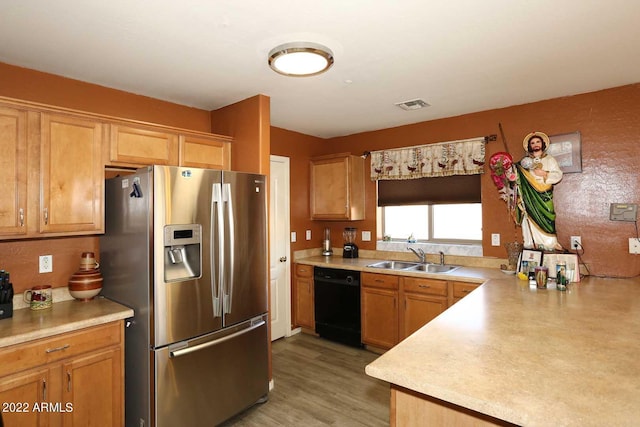 kitchen featuring sink, light wood-type flooring, dishwasher, and stainless steel refrigerator with ice dispenser