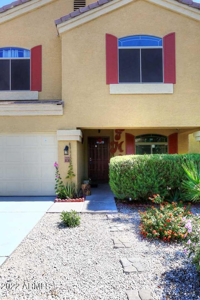 view of front of property with a garage