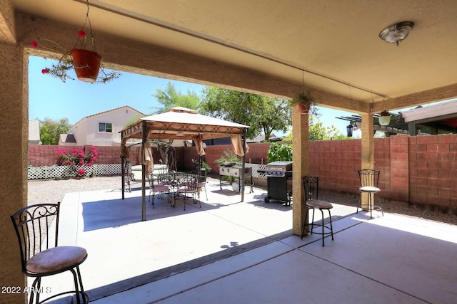 view of patio / terrace featuring a gazebo and area for grilling