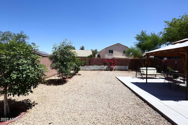 view of yard with a gazebo and a patio