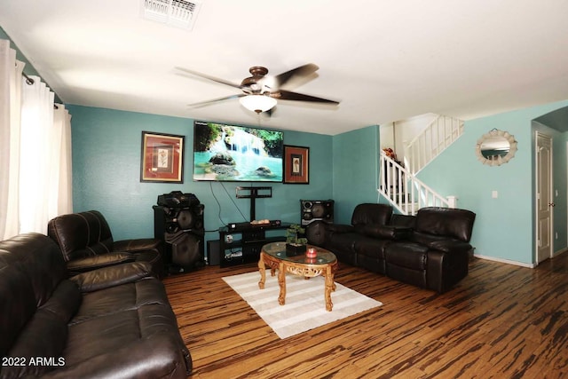 living room featuring ceiling fan and wood-type flooring